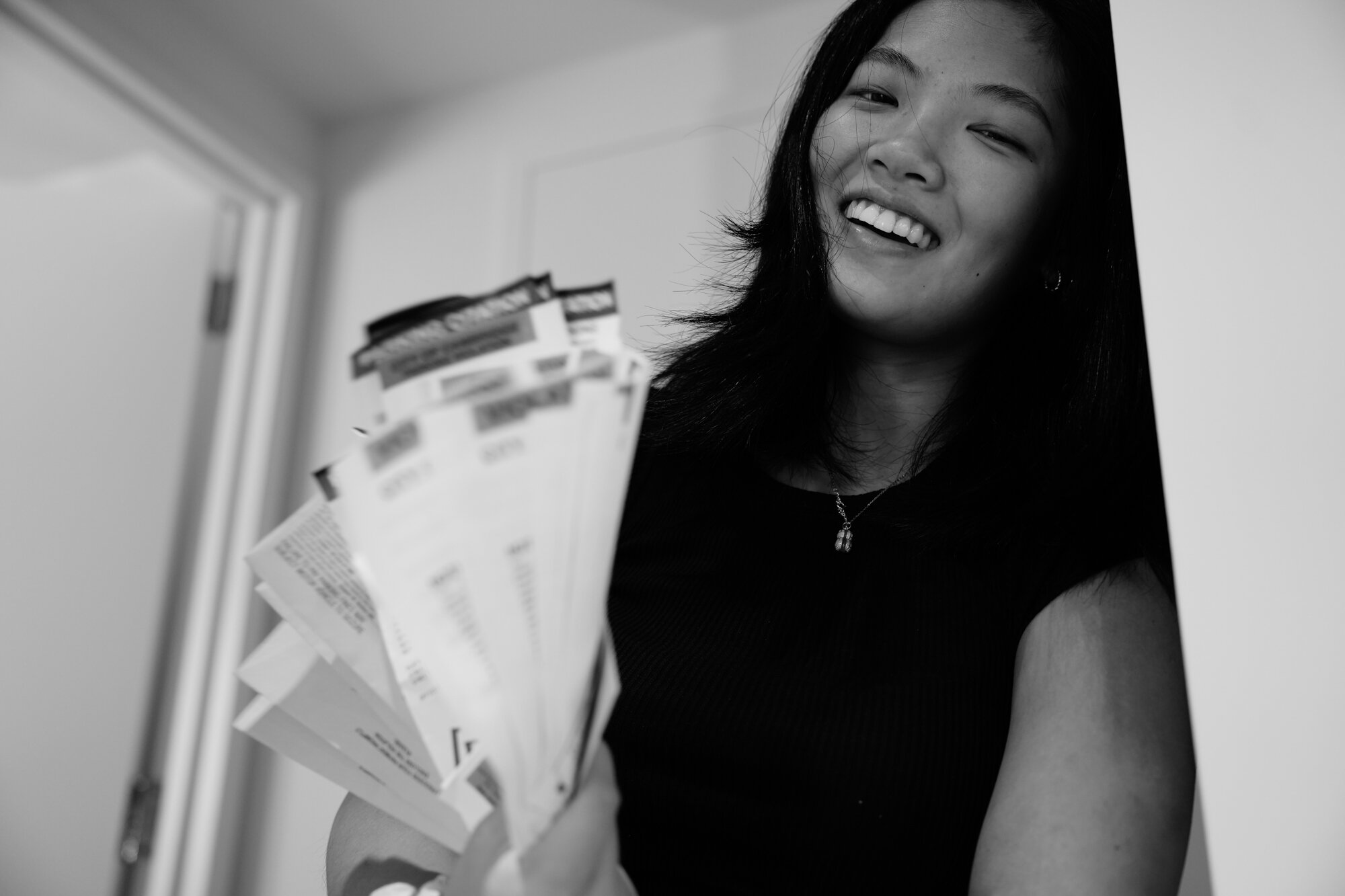 Rachel Zhong displays parking tickets she received in New York. Nov. 22, 2025.